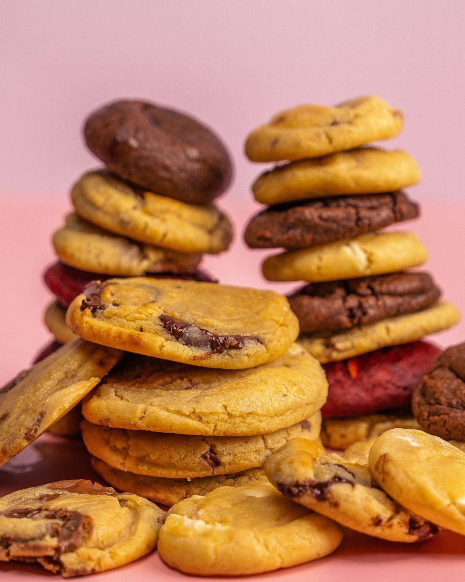 Delicious stack of assorted chocolate chip cookies, perfect for snack and dessert ideas.
